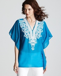 Lend a touch of boho-chic to your daily repertoire with this Karen Kane top touting glistening metallic embroidery. Lend a touch of boho-chic to your daily repertoire with this Karen Kane top touting glistening metallic embroidery.