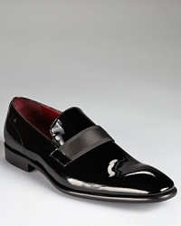 Complete your black-tie ensemble with a shiny patent leather dress shoe, perfectly crafted and with a band across the tongue for a unique touch. Complete your black-tie ensemble with a shiny patent leather dress shoe, perfectly crafted and with a band across the tongue for a unique touch.