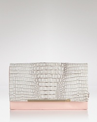 DIANE von FURSTENBERG's patent and embossed leather clutch is a cool girl's party plus one. Textured leather is on trend, while the shape is utterly revel-ready.