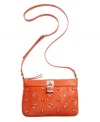 Absolutely delicious. This eye-catching crossbody from Nine West in an assortment of scrumptious colors is the perfect complement to your summer wardrobe. Polished silver-tone ball and circle design adorn the front with a sweet signature lock, for an altogether carefree style you'll love.
