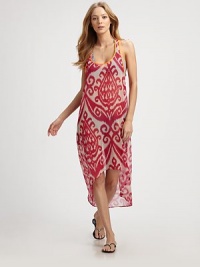 This voluminous, semi-sheer style features a bright ikat print and an asymmetrical hem. ScoopneckSleevelessRacerbackContrast pipingAsymmetrical hemAbout 50 from shoulder to hemPolyesterHand washMade in USA of imported fabrics