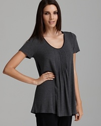 Though this casual short sleeve tee is loose, the darts in the front and back ensure that it still fits properly for outside wear. Though this casual short sleeve tee is loose, the darts in the front and back ensure that it still fits properly for outside wear.