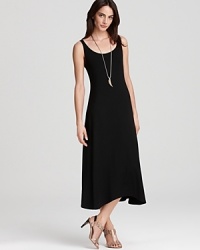 Rendered with a hint of stretch, this Eileen Fisher dress cascades over your curves with a rippling A-line silhouette for effortless figure flattery. Rendered with a hint of stretch, this Eileen Fisher dress cascades over your curves with a rippling A-line silhouette for effortless figure flattery.