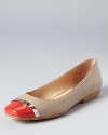 In bright citrus hues, the Pash cap toe flats offer up a hint of colorful style. From Calvin Klein.