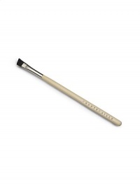 A small, soft angled brush to shape eyebrows, made of boar bristle. 