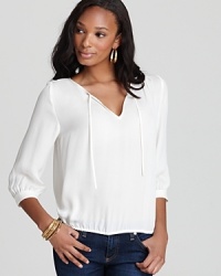 Simple and elegant, this Joie tie-front top is a must-have for easy chic. Simple and elegant, this Joie tie-front top is a must-have for easy chic.