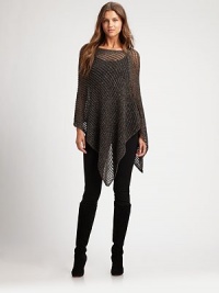 Metallic thread enlivens this feminine mesh poncho with sparkling glamour.BoatneckPull-on styleHandkerchief hemCotton/viscose/linen/metallic threadDry cleanImported of Italian fabric Metallic thread enlivens this feminine mesh poncho with sparkling glamour.BoatneckPull-on styleHandkerchief hemCotton/viscose/linen/metallic threadDry cleanImported of Italian fabric