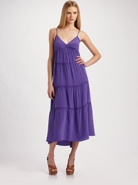 A feminine design in luxurious silk with alluring v-neckline.Adjustable spaghetti straps Back tie About 34 from natural waist Silk Dry clean Imported A feminine design in luxurious silk with alluring v-neckline.Adjustable spaghetti straps Back tie About 34 from natural waist Silk Dry clean Imported
