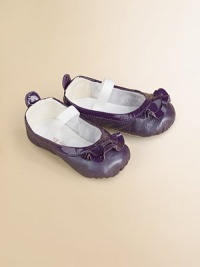 Dainty pearlized patent leather flats for baby with ruffle trim and elastic strap for a comfy, cozy fit.Adjustable elastic strapLeather upperCotton liningLeather soleImported Dainty pearlized patent leather flats for baby with ruffle trim and elastic strap for a comfy, cozy fit.Adjustable elastic strapLeather upperCotton liningLeather soleImported