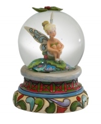 In time for the holidays, Tinkerbell, a much loved Disney character, is presented by Jim Shore as a charming snow globe with folk art-inspired details. In time for the holidays, Tinkerbell, a much loved Disney character, is presented by Jim Shore as a charming snow globe with folk art-inspired details.