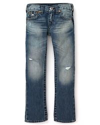 Slim-cut distressed jeans with ripped details translate to tough True Religion denim. Slim-cut distressed jeans with ripped details translate to tough True Religion denim.
