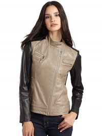 THE LOOKColorblock designStand collar with front snap tabAsymmetrical front zipperDual zip chest pocketsSnap flap chest pocket with rhinestone accentsLong sleeves with knit insets and zip cuffsDual front besom pockets with rhinestone accentsTiered hemQuilted dome inset at backTHE FITAbout 22 from shoulder to hemTHE MATERIALLeatherCombo: rayon/nylon/spandexFully linedCARE & ORIGINDry clean by a leather THE LOOKColorblock designStand collar with front snap tabAsymmetrical front zipperDual zip chest pocketsSnap flap chest pocket with rhinestone accentsLong sleeves with knit insets and zip cuffsDual front besom pockets with rhinestone accentsTiered hemQuilted dome inset at backTHE FITAbout 22 from shoulder to hemTHE MATERIALLeatherCombo: rayon/nylon/spandexFully linedCARE & ORIGINDry clean by a leather