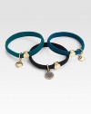 A set of three colorful hair accessories with 10K goldplated logo embellished charms.Smooth polyester elastic bands10k goldplated brass and zinc logo charms and beadsImported