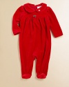 A beautiful long-sleeved footed coverall in plush velour is highlighted with pretty puffed sleeves and an empire waist.Peter Pan collarLong sleevesBack buttonsGathered empire waistBottom snaps80% cotton/20% polyesterMachine washImported Please note: Number of buttons may vary depending on size ordered. 