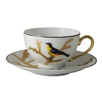Embellished with a yellow-breasted songbird and a goldtone handle, this porcelain tea cup from Bernardaud brings an elegantly fanciful look to your table. Embellished with a yellow-breasted songbird and a goldtone handle, this porcelain tea cup from Bernardaud brings an elegantly fanciful look to your table.
