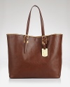 Designed with a timeless shape and sleek hardware, Longchamp's luxurious tote defines effortless day-right style.