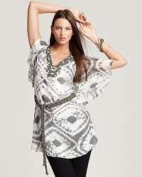 Lush braiding and beading accent the neckline and belt of this Lafayette 148 tie-dye silk tunic, for a distinctly artisanal approach to a carefree silhouette. Lush braiding and beading accent the neckline and belt of this Lafayette 148 tie-dye silk tunic, for a distinctly artisanal approach to a carefree silhouette.