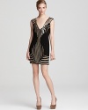 Gold and silver sequins form an Art Deco-inspired formation on this little black Basix dress.