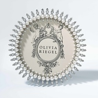 Beautiful and elegant round frame with dozens of hand-set faux pearl and Swarovski crystal detailing. Beautiful and elegant round frame with dozens of hand-set faux pearl and Swarovski crystal detailing.