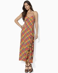A vibrant-hued plaid lends seasonal appeal to a feminine maxi dress, crafted with a cascade of ruffles at the skirt and delicate spaghetti straps. A vibrant-hued plaid lends seasonal appeal to a feminine maxi dress, crafted with a cascade of ruffles at the skirt and delicate spaghetti straps.