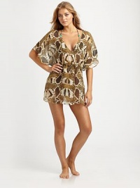 A sexy python print and deep-v back add drama to the traditional coverup. The drawstring waist creates the idyllic silhouette. V-neckDolman sleevesDrawstring waistSilkHand washImported A sexy python print and deep-v back add drama to the traditional coverup. The drawstring waist creates the idyllic silhouette. V-neckDolman sleevesDrawstring waistSilkHand washImported