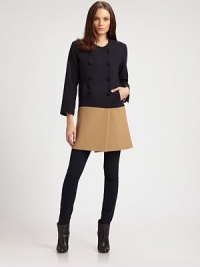 This chic, structural wool design has a decidedly retro sensibility.Jewel necklineDouble-breasted button frontSide slash pocketsThree-quarter sleeves with vented cuffsFully linedAbout 33 from shoulder to hemWoolDry cleanMade in USAModel shown is 5'10 (177cm) wearing US size Small. This chic, structural wool design has a decidedly retro sensibility.Jewel necklineDouble-breasted button frontSide slash pocketsThree-quarter sleeves with vented cuffsFully linedAbout 33 from shoulder to hemWoolDry cleanMade in USAModel shown is 5'10 (177cm) wearing US size Small.