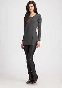 Side cutouts and a lengthy fit give a casual-cool vibe to this soft jersey knit. RoundneckLong sleevesCutout sidesLonger length hits below the hips48% polyester/48% rayon/4% spandexDry cleanMade in USAModel shown is 5'10 (177cm) wearing US size Small. Side cutouts and a lengthy fit give a casual-cool vibe to this soft jersey knit. RoundneckLong sleevesCutout sidesLonger length hits below the hips48% polyester/48% rayon/4% spandexDry cleanMade in USAModel shown is 5'10 (177cm) wearing US size Small.