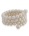 Four is better than one, especially when it comes to stacking on rows of jewelry. Coil bracelet by Carolee features four rows of lustrous glass pearl (10-12 mm) meant to snake delicately around your wrist. Stretches to fit wrist. Crafted in mixed metal. Approximate diameter: 2-1/4 inches.