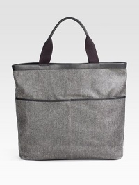 EXCLUSIVELY OURS. We designed this utilitarian nylon bag so every on-the-go essential has a convenient place to stow away. No closure Top handles Exterior slip pockets Interior zip pocket Fully lined Polyester/nylon 15W X 18H X 6¼D Imported 