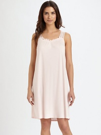 An airy silhouette, discreetly embellished with elegant lace straps, ruffled trim and feminine sheering. Gathered scoopneck with ruffled trimSleevelessSemi-sheer lace straps with scalloped edgesFront ruchingAbout 37 from shoulder to hemBody: 50% cotton/50% modalLace: 85% polyamide/15% elastaneMachine washImported An airy silhouette, discreetly embellished with elegant lace straps, ruffled trim and feminine sheering. Gathered scoopneck with ruffled trimSleevelessSemi-sheer lace straps with scalloped edgesFront ruchingAbout 37 from shoulder to hemBody: 50% cotton/50% modalLace: 85% polyamide/15% elastaneMachine washImported