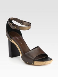 Studded leather straps surround this cork platform clog design, concluding with a secure wrap-around ankle strap. Stacked heel, 3 (75mm)Cork platform, 1 (25mm)Compares to a 2 heel (50mm)Leather upperLeather liningCork and rubber solePadded insoleMade in Italy Studded leather straps surround this cork platform clog design, concluding with a secure wrap-around ankle strap. Stacked heel, 3 (75mm)Cork platform, 1 (25mm)Compares to a 2 heel (50mm)Leather upperLeather liningCork and rubber solePadded insoleMade in Italy