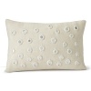 Glass mirror accents reflect light across this decorative pillow from JR by John Robshaw.