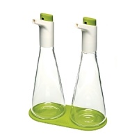 Adjust the flow of liquid while you pour for perfectly dressed salads and dishes. Simply depress the large button on each cap to control the flow as you pour - pressing more for thicker liquids, such as oil, and less for thinner, such as vinegar. The flasks curved shape is intuitive to hold and stores easily on the accompanying silicone coaster. Adjust the flow of liquid while you pour for perfectly dressed salads and dishes. Simply depress the large button on each cap to control the flow as you pour - pressing more for thicker liquids, such as oil, and less for thinner, such as vinegar. The flasks curved shape is intuitive to hold and stores easily on the accompanying silicone coaster.