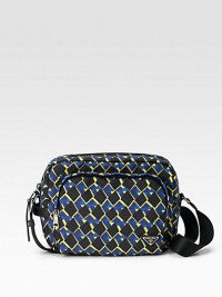 A vivid pattern in rugged, beautifully crafted nylon with leather trim and logo plate detail. Zip closure Front, interior zip pockets Adjustable shoulder strap Nylon lining 11¾W X 8½H X 4¼D Imported A vivid pattern in rugged, beautifully crafted nylon with leather trim and logo plate detail. Zip closure Front, interior zip pockets Adjustable shoulder strap Nylon lining 11¾W X 8½H X 4¼D Imported