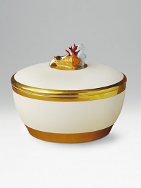 An exquisite porcelain vessel, topped with porcelain sea creatures on the lid, cradles a lightly scented, 3-wick candle inside. Handpainted 14k gold trim Pink Champagne scented candle Crafted of Limoges porcelain paste Beautifully gift boxed About 6¾ diameter Made in Portugal An exquisite porcelain vessel, topped with porcelain sea creatures on the lid, cradles a lightly scented, 3-wick candle inside. Handpainted 14k gold trim Pink Champagne scented candle Crafted of Limoges porcelain paste Beautifully gift boxed About 6¾ diameter Made in Portugal