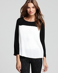 A silky-soft Joie top featuring classic color block details in two of the most celebrated neutrals--what's black, white and sought after this season. A silky-soft Joie top featuring classic color block details in two of the most celebrated neutrals--what's black, white and sought after this season.