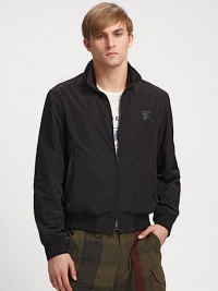 A lightweight layer with no equal, expertly designed in smooth nylon with logo chest detail and knit trim for a better fit. Zip frontAbout 25 from shoulder to hemPolyesterMachine washImported A lightweight layer with no equal, expertly designed in smooth nylon with logo chest detail and knit trim for a better fit. Zip frontAbout 25 from shoulder to hemPolyesterMachine washImported