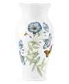 Crafted of elegant white porcelain, this Lenox vase combines the beloved Butterfly Meadow motif with a scalloped edge and textured accents for a look of country charm.