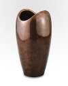 The rounded shape of this handcrafted vase has classic appeal whether you're given to a single bud, a well-edited bouquet or a wild bunch of flowers. And its bronze-finish alloy is a refreshing change from more traditional glass silhouettes. From the Heritage Pebble CollectionAntique copper-plated alloy10H X 5¼ diam.Wipe cleanImported