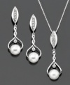 Awe-inspiring design, perfect for a truly elegant look. This pendant and earrings set features round-cut diamond (1/10 ct. t.w.) and cultured freshwater pearl (6.5-7 mm) set in sterling silver. Pendant measures approximately 18 inches with a 1-1/4 inch drop. Earrings measure approximately 1-1/4 inches.