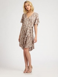 An effortless wrap silhouette, lightly ruffled along the hem in a muted tawny hue.Split short sleevesWrap frontSelf-beltAngled hemAbout 21 from natural waistPolyesterDry cleanImportedModel shown is 5'9½ (176cm) wearing US size Small. An effortless wrap silhouette, lightly ruffled along the hem in a muted tawny hue.Split short sleevesWrap frontSelf-beltAngled hemAbout 21 from natural waistPolyesterDry cleanImportedModel shown is 5'9½ (176cm) wearing US size Small.