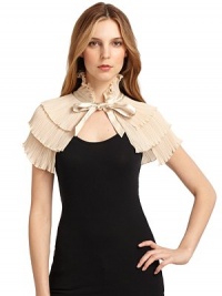 THE LOOKTiered accordion pleatingSatin ribbon tie closureGently ruffledTHE FITAbout 11 from shoulder to hemTHE MATERIALPolyesterCARE & ORIGINDry cleanImported THE LOOKTiered accordion pleatingSatin ribbon tie closureGently ruffledTHE FITAbout 11 from shoulder to hemTHE MATERIALPolyesterCARE & ORIGINDry cleanImported