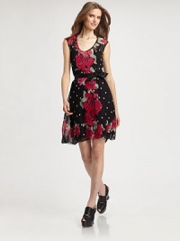 Semi-sheer silk silhouette in a whimsical floral and polka-dot print, finished with cap sleeves and a flattering self tie. ScoopneckCap sleevesSelf tie at waistSemi-sheer hemBack button closureSemi-sheer backAbout 20 from natural waistSilkDry cleanMade in USA of imported fabricModel shown is 5'10 (177cm) wearing US size 2. Semi-sheer silk silhouette in a whimsical floral and polka-dot print, finished with cap sleeves and a flattering self tie. ScoopneckCap sleevesSelf tie at waistSemi-sheer hemBack button closureSemi-sheer backAbout 20 from natural waistSilkDry cleanMade in USA of imported fabricModel shown is 5'10 (177cm) wearing US size 2.