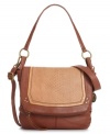 For the girl on-the-go, this silhouette from The Sak will get you there in style. Croc-embossed leather adorns the front flap and is punctuated with antique brass-tone hardware for a luxe, laid-back look. Sturdy crossbody strap keeps hands free for holding that steaming cup of coffee and morning paper.