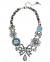 Put a bow on it! Betsey Johnson's darling frontal necklace showcases a crystal-accented bow charms with teardrop charm, round glass opal charms and crystal accents. Setting and chain crafted in silver tone mixed metal. Approximate length: 16 inches + 3-inch extender. Approximate drop: 2-1/4 inches.