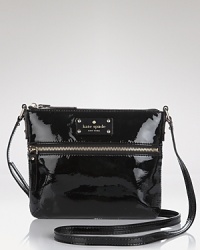 Compact style gets glossy with this coated leather crossbody bag from kate spade new york. Sized to slip across the body, this bag is a small way to add major shine.