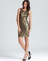 Covered in gilded sequins, BCBGMAXAZRIA's embellished Lucianna dress exudes a shimmering look for the season.