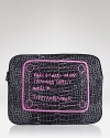 The writing is on this neoprene MARC BY MARC JACOBS computer case, cleverly constructed to carry your computer while it flaunts your cool-girl credentials.
