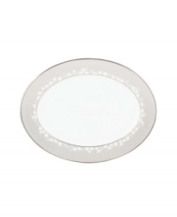 This large bone china platter will hold attention with a delicate floral design with textured white beads and elegant platinum trim. From Lenox's dinnerware and dishes collection. This large bone china platter will hold attention with a delicate floral design with textured white beads and elegant platinum trim. From Lenox's dinnerware and dishes collection.