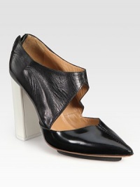 Elevated by a contrasting heel and island platform, this lustrous leather pump finishes the look with a cutout upper, point toe and exposed back zipper. Self-covered heel, 4 (100mm)Island platform, ½ (15mm)Compares to a 3½ heel (90mm)Leather upperPoint toeExposed back zipperLeather liningLeather and rubber solePadded insoleImportedOUR FIT MODEL RECOMMENDS ordering one half size up as this style runs small. Elevated by a contrasting heel and island platform, this lustrous leather pump finishes the look with a cutout upper, point toe and exposed back zipper. Self-covered heel, 4 (100mm)Island platform, ½ (15mm)Compares to a 3½ heel (90mm)Leather upperPoint toeExposed back zipperLeather liningLeather and rubber solePadded insoleImportedOUR FIT MODEL RECOMMENDS ordering one half size up as this style runs small.